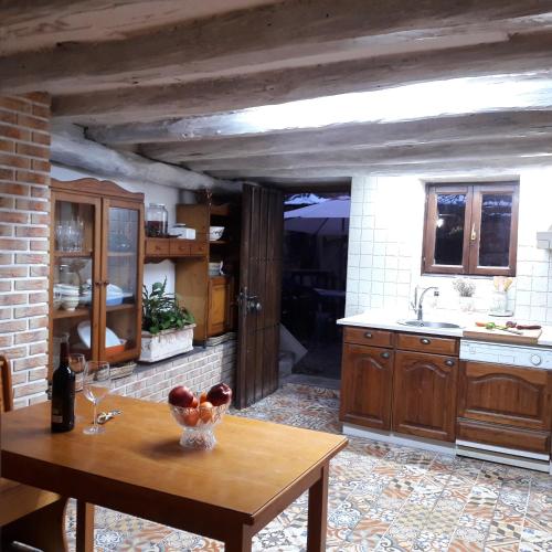 a kitchen with a table with a bowl of fruit on it at Casa de la abuela Bego in Los Molinos de Ocón