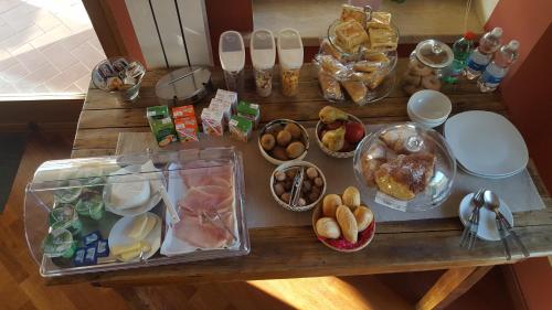 a table topped with lots of different types of food at Il Nido del Falco in Castel Gandolfo