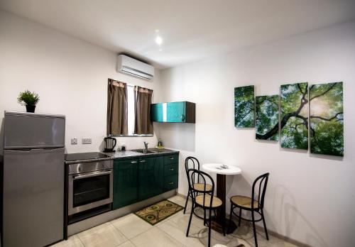 Kuchyň nebo kuchyňský kout v ubytování Estrella Lodging