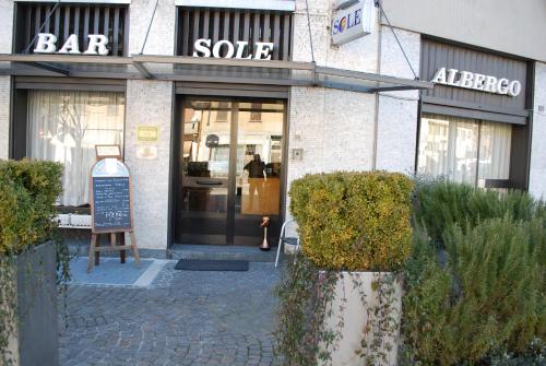 a store front with a sign in front of a store at Albergo Sole in Mariano Comense