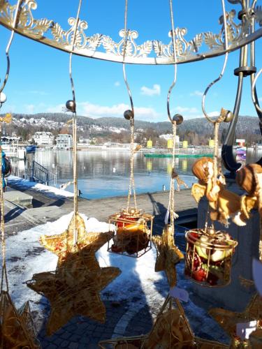 a chandelier with christmas lights and stars at Boutiquehotel Wörthersee - Serviced Apartments in Velden am Wörthersee