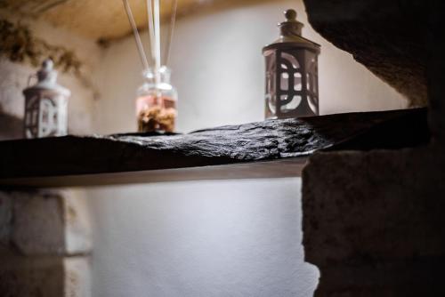 two lights on top of a counter in a room at Sacratum B&B Suite Spa in Mesagne