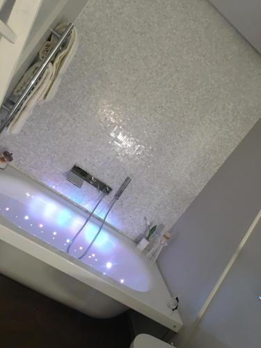 a bathroom with a white toilet and a sink at Luxury My home in Tolentino