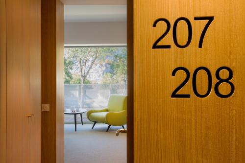 a room with a door with the number at Best Western Plus Hotel Divona Cahors in Cahors