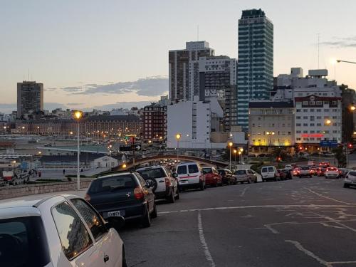a bunch of cars parked in a parking lot in a city at Departamento Víctoria in Mar del Plata