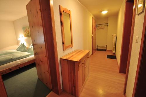 a hallway leading to a bedroom with a bed at Dent Blanche in Zermatt