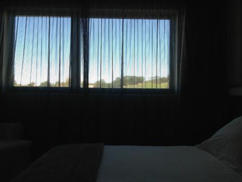 Una cama o camas en una habitación de Hotel Adelma