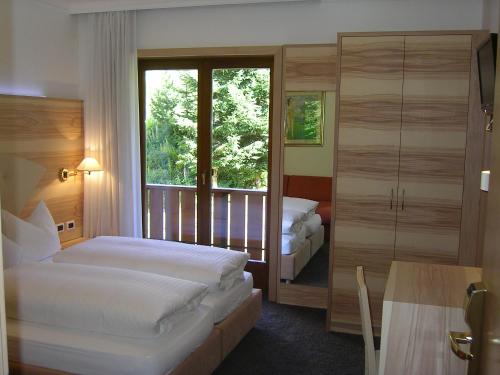 Posteľ alebo postele v izbe v ubytovaní Hotel Garni Royal