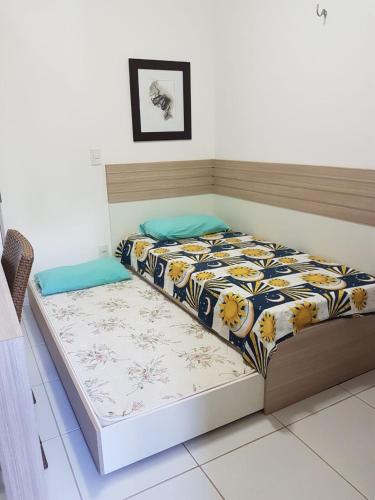 a bed in a room with at Condomínio Palm Beach in Aquiraz