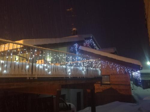 a balcony with christmas lights on a building at B&B La Maison D' Amelie Camere e Appartamenti in Fenis