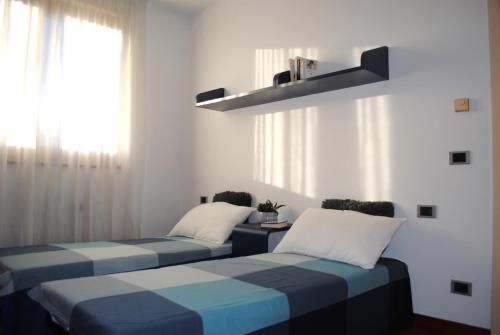 Postel nebo postele na pokoji v ubytování Bnbook - Residenza Naggi