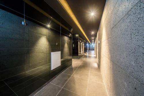 a long hallway with lights in a building at Anyang Boutique Hotel AMA in Anyang