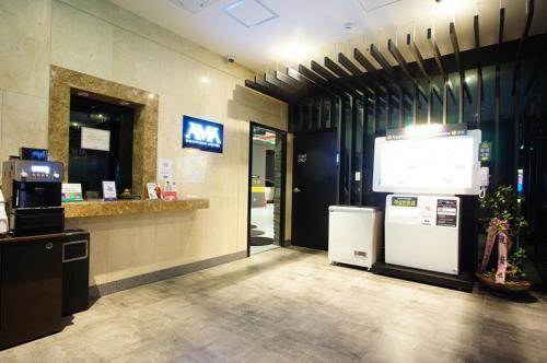 a lobby with a large screen in a building at Anyang Boutique Hotel AMA in Anyang