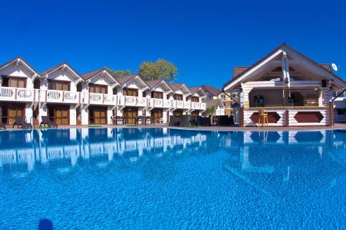 a large swimming pool in front of a hotel at Hotel White beach All Inclusive in Anapa