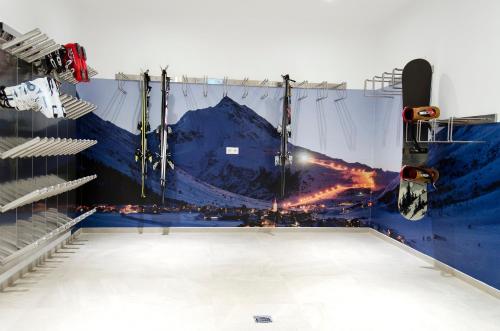 a stage with a mountain painted on the wall at St. Florian Appartements in Galtür