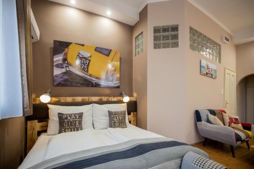 En eller flere senge i et værelse på Hotel Carpe Diem
