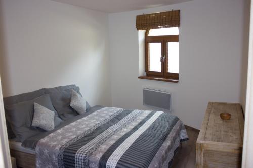 Ένα ή περισσότερα κρεβάτια σε δωμάτιο στο Apartmán Essi Tále- Chopok