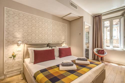 Säng eller sängar i ett rum på The Spanish Suite Via di Ripetta
