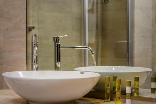 a bathroom with a white sink and a faucet at Eurostars Roma Aeterna in Rome