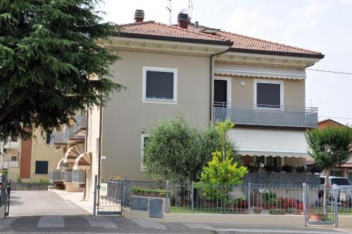 a house with a fence in front of it at GiaLoSa Biker House in Villa Verucchio