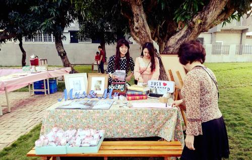 two women standing in front of a table with books at Taitung Matsunogien in Taitung City