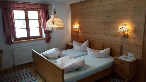a bedroom with two beds with pillows on it at Bio-Berghof in Niederthai