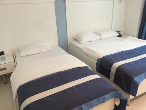 Säng eller sängar i ett rum på Samsun Sahin Hotel 2