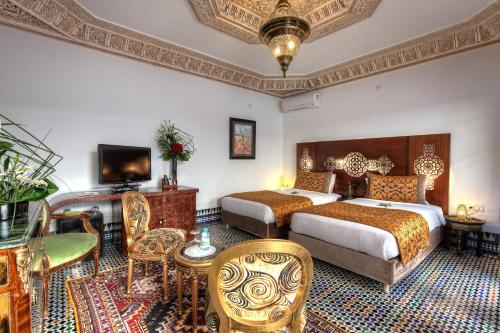 Postel nebo postele na pokoji v ubytování Riad El Amine Fès - Historic Hotels Worldwide