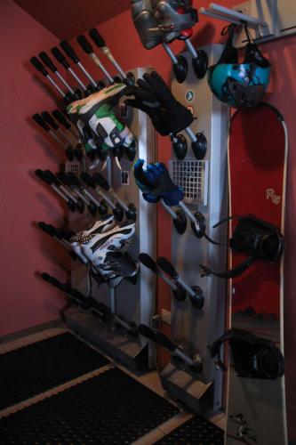 a room with a rack of shoes and ski equipment at Arthotel Mini-Hotel in Bukovel