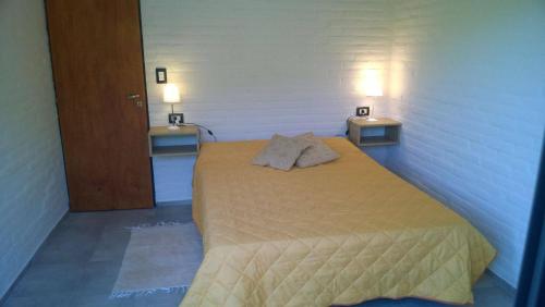 Ένα ή περισσότερα κρεβάτια σε δωμάτιο στο Cabañas Don Eduardo