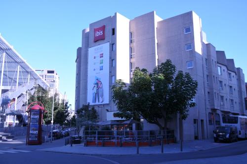 a building with a sign on the side of it at ibis Antwerpen Centrum in Antwerp