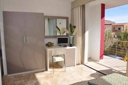TV a/nebo společenská místnost v ubytování Gil's Hotel