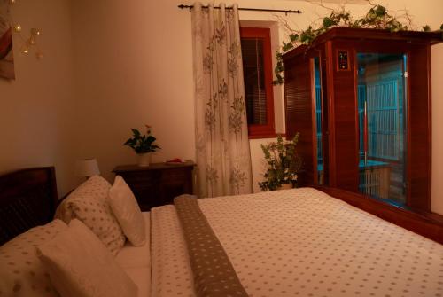 a bedroom with a bed and a window at Penzion Recall in Troskovice