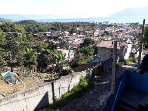a view from the top of a hill of a town at Pé na areia in São Sebastião