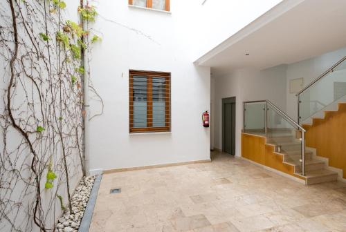 a hallway of a house with stairs and a wall at A dos pasos de Todo in Málaga