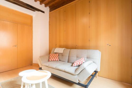 a living room with a couch and a table at A dos pasos de Todo in Málaga