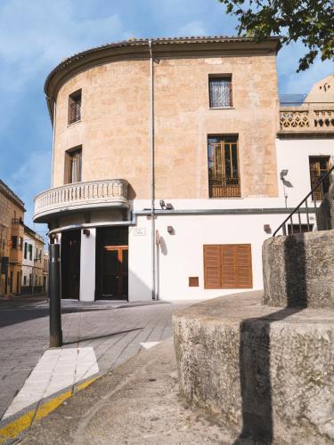 a building on the side of a street at TI Central Maria in Maria de la Salut