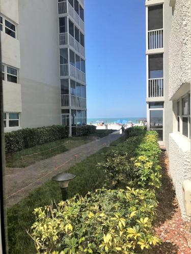 a view from a window of a yard with buildings at Crescent Arms 105N in Sarasota