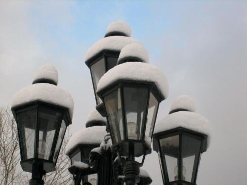 a group of street lights covered in snow at Le Baron Apartments in Stavelot