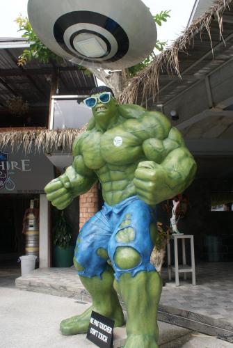 a statue of a hulk in front of a building at Momento Resort in Pattaya South