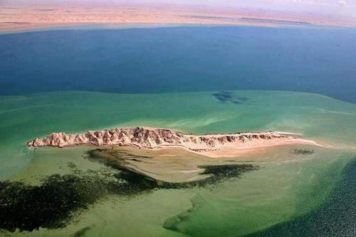 an island in the middle of a body of water at Studio Relax in Dakhla
