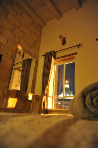 a room with a window and a window at Aleen Guest House in Nazareth