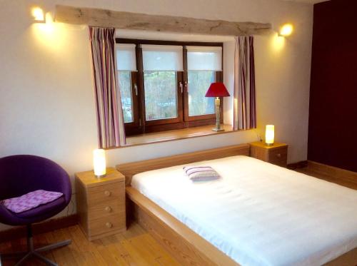 מיטה או מיטות בחדר ב-La villa des Savoyards