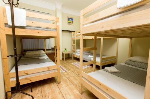 a room with four bunk beds in it at Rivyersky Hostel in Sochi