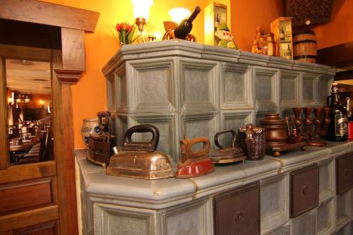 a large wooden hutch with a bunch of items on it at Hotel Restaurant Svejk in Bublava