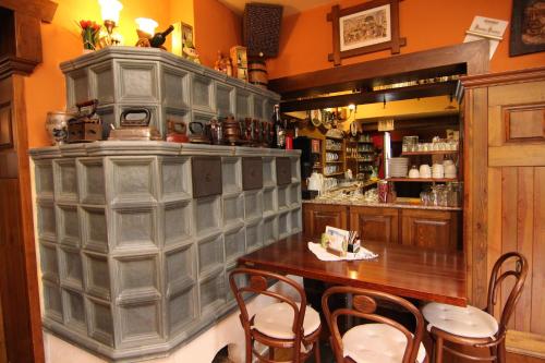 a restaurant with a table and chairs in a room at Hotel Restaurant Svejk in Bublava