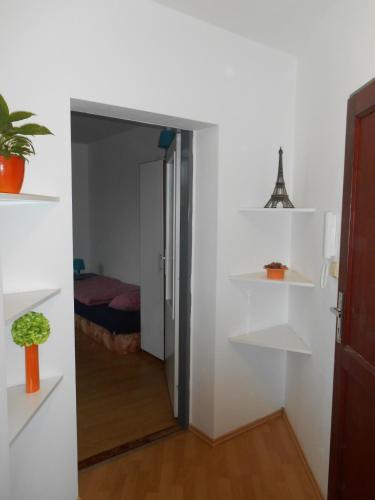 a room with a door open to a bedroom at Penzion V Zatáčce in Plzeň
