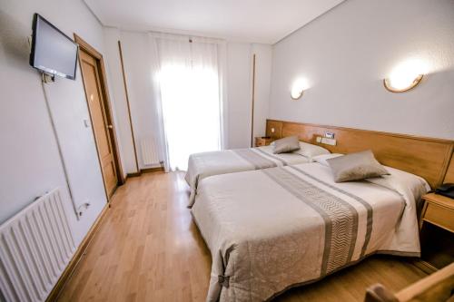 Postel nebo postele na pokoji v ubytování Alvi