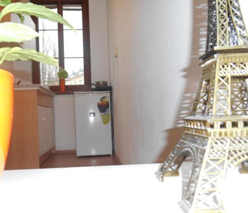 a model of the eiffel tower next to a refrigerator at Penzion V Zatáčce in Plzeň