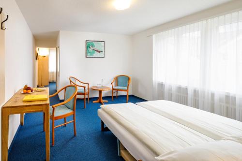 Un ou plusieurs lits dans un hébergement de l'établissement Central Hotel Post